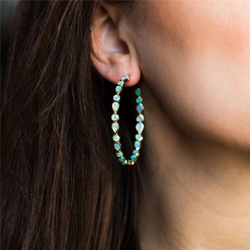 Brillo elegante - Pendientes de ópalo azul y dorado