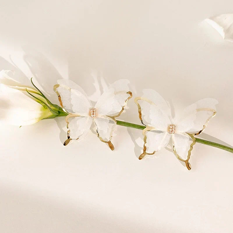 Jean – Pendientes de mariposa de tejido ligero