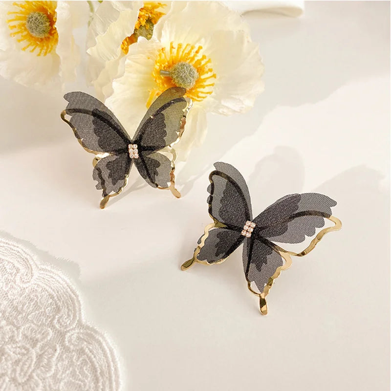 Jean – Pendientes de mariposa de tejido ligero