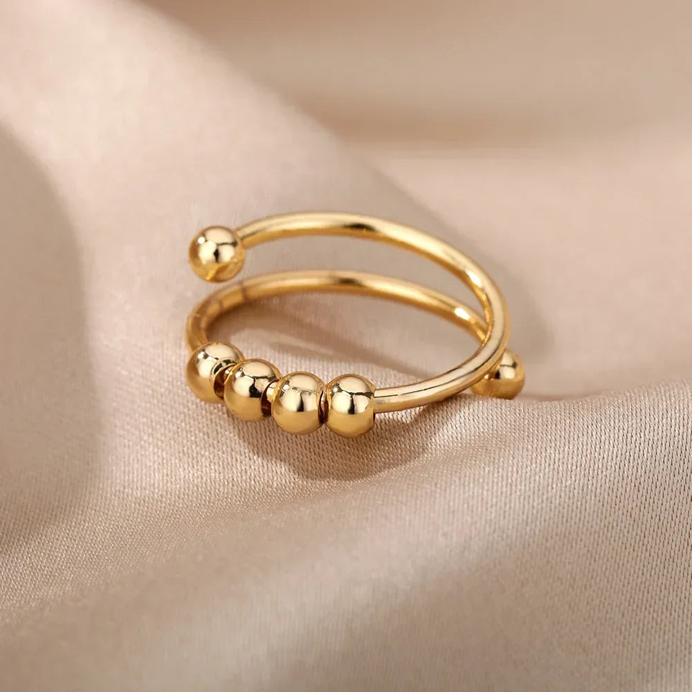 Maelis – Anillo antiestrés con perlas giratorias