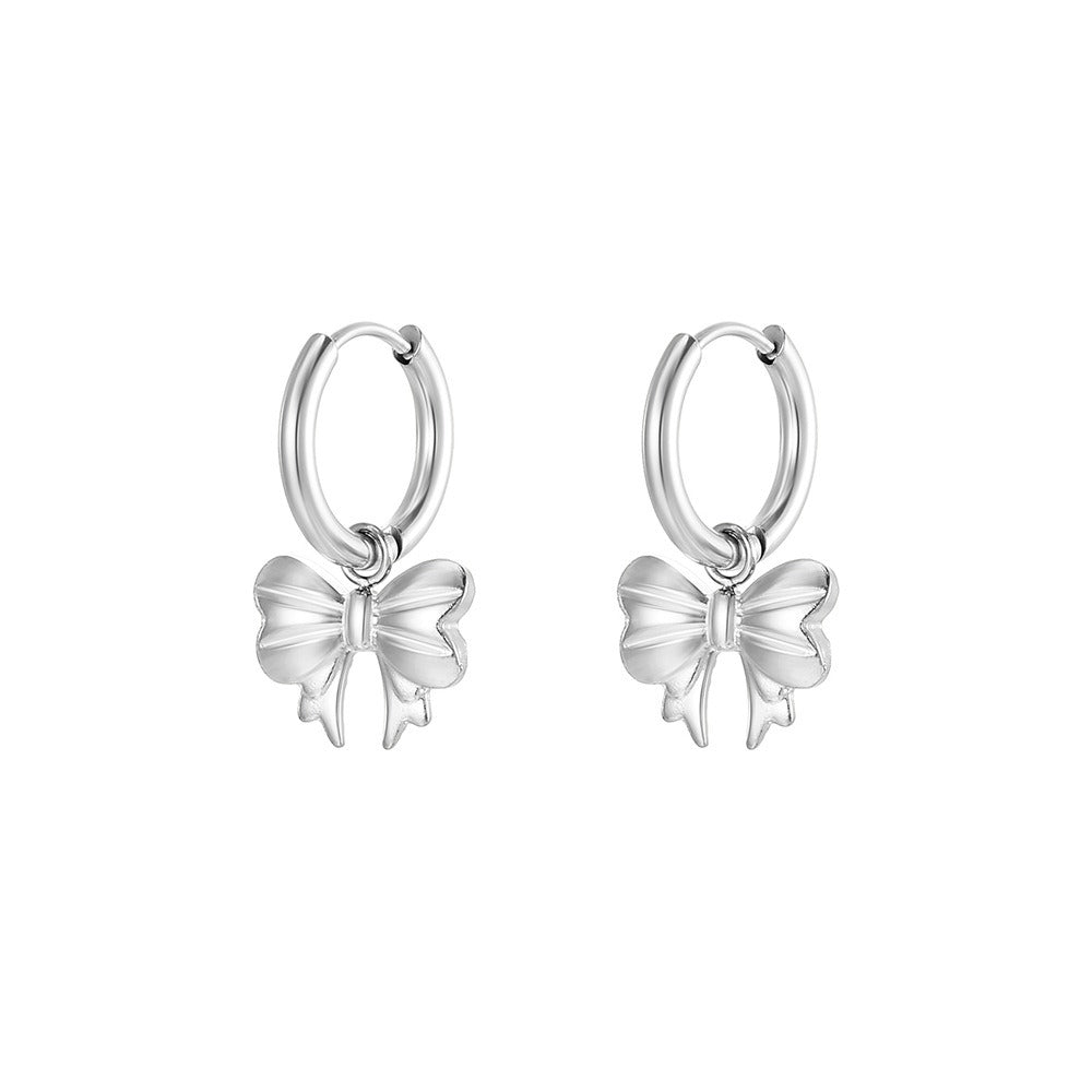 Carla – Aretes lazo bañados en oro